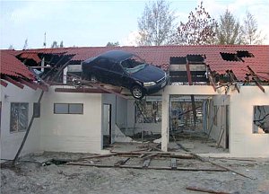 Tsunami damage: car on roof.